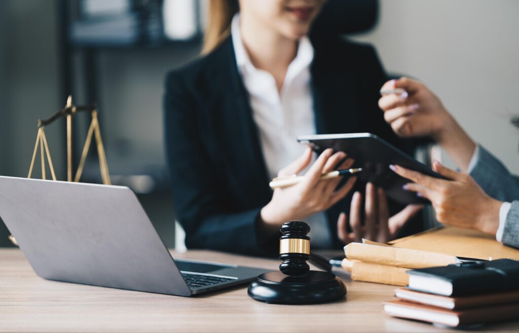 Business Discussion in Office with Laptop and Gavel